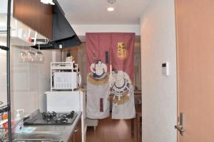 Hotel JTK 新今宮駅徒歩2分 大阪の観光地へアクセス抜群にあるキッチンまたは簡易キッチン