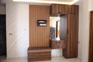 a room with a wooden cabinet and a mirror at Malak House in Imsouane