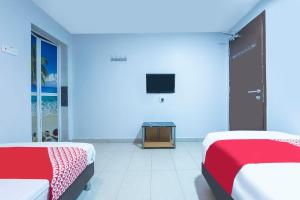 Postel nebo postele na pokoji v ubytování D Anugerah Hotel