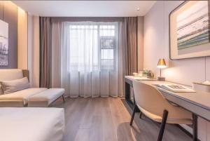 Ένα ή περισσότερα κρεβάτια σε δωμάτιο στο Atour Hotel Nanjing South Station University of Aeronautics