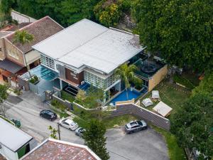 an overhead view of a house with a pool at 6BR Homestay KL Pool Villa - 4KM To KLCC by Verano in Ampang