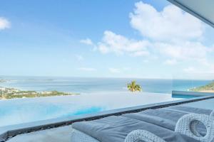a view of the ocean from the balcony of a villa at Seaview Dreamscape Villa in Amphoe Koh Samui