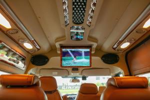 a view from the back of a bus with a television at Majesty Luxury Prime Cruise by Premier Group in Ha Long
