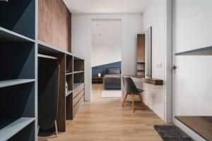 a room with a desk and a bedroom at Lumi Tropicana Muji Concept in Petaling Jaya +44 photos