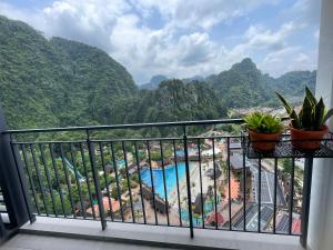 a balcony with a view of the mountains at Sunway City Ipoh Tambun Onsen Cozy Retreat 8pax in Tambun