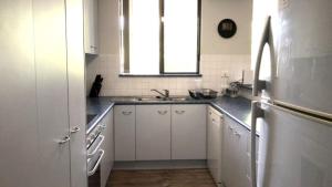 Kuchyň nebo kuchyňský kout v ubytování Salt Spray Unit 3