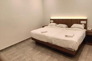 Postel nebo postele na pokoji v ubytování Green Tea Hotels