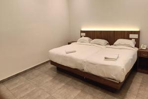 Postel nebo postele na pokoji v ubytování Green Tea Hotels