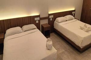 Postel nebo postele na pokoji v ubytování Green Tea Hotels