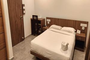 Postel nebo postele na pokoji v ubytování Green Tea Hotels