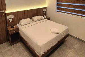 Postel nebo postele na pokoji v ubytování Green Tea Hotels