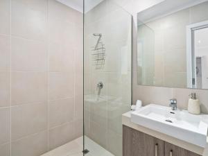 a bathroom with a sink and a shower at Yarrawonga Lakeside Apartment 50 in Mulwala