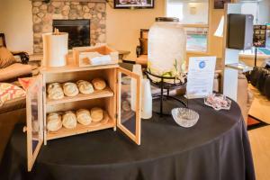a table with a bunch of donuts on it at Quality Inn & Suites Sequim at Olympic National Park in Sequim +36 photos