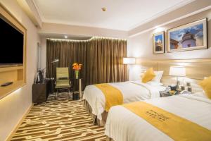 Voodi või voodid majutusasutuse Metropark Hotel Macau toas