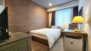 A television and/or entertainment centre at Platon Hotel Yokkaichi