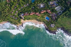 an aerial view of a beach with houses and the ocean at Anantara Peace Haven Tangalle Resort in Tangalle
