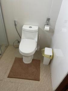 a small bathroom with a toilet and a rug at Apartment in Koh Samui +17 photos