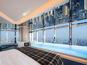 Postel nebo postele na pokoji v ubytování ISEYA Panoramic Hotel Changsha Wuyi Square Flagship + 89 fotografií