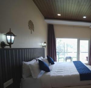 Postel nebo postele na pokoji v ubytování Coastal Grand Resorts - Akshaya