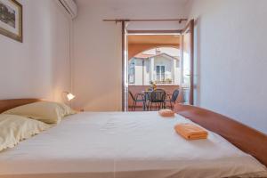 Posteľ alebo postele v izbe v ubytovaní Apartments Ruze