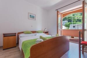 Posteľ alebo postele v izbe v ubytovaní Apartments Ruze