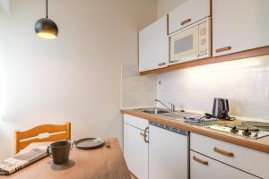 Kuchyň nebo kuchyňský kout v ubytování Hotel Esplanade Dortmund