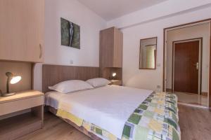 Posteľ alebo postele v izbe v ubytovaní Apartments Ruze