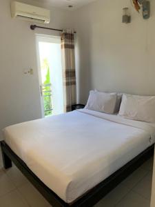 Katil atau katil-katil dalam bilik di Đại An Hotel Bến Tre