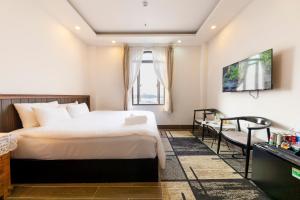 Postel nebo postele na pokoji v ubytování Olagi Hotel 2
