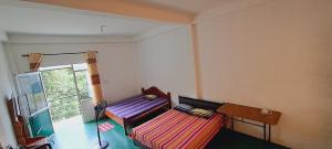 Postel nebo postele na pokoji v ubytování 38 guest house