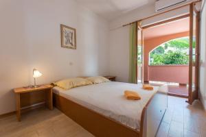 Posteľ alebo postele v izbe v ubytovaní Apartments Ruze