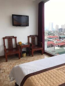 Postel nebo postele na pokoji v ubytování Sắc Màu Hotel Hn - by BAY LUXURY