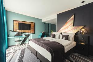 Ένα ή περισσότερα κρεβάτια σε δωμάτιο στο Holiday Inn - the niu, Flash Berlin Charlottenburg by IHG