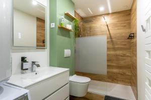 a bathroom with a toilet and a shower at La Maison du Parc in Digoin +40 photos