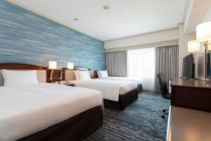Кровать или кровати в номере Hotel Nikko Kansai Airport - 3 mins walk to the airport