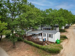 an overhead view of a tiny house with a porch at Albatross Mobile Homes on Valamar Camping Lanterna in Poreč
