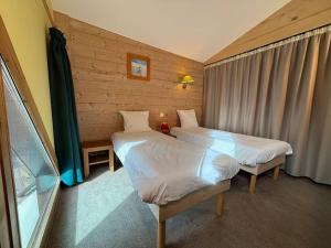 Postel nebo postele na pokoji v ubytování Résidence Christiana 603 Clés Blanches Courchevel