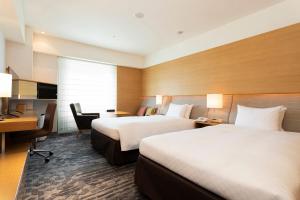 Кровать или кровати в номере Hotel Nikko Kansai Airport - 3 mins walk to the airport