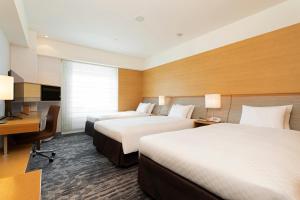 Кровать или кровати в номере Hotel Nikko Kansai Airport - 3 mins walk to the airport