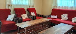 Posezení v ubytování Greenfield Homestay -Full board