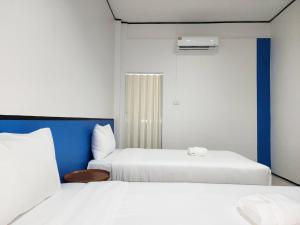 Postel nebo postele na pokoji v ubytování RYB Hostel Phuket
