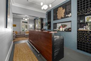 a bar in the middle of a room with a couch at Purple Zebra Bowral in Bowral +17 photos