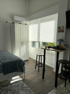 Postel nebo postele na pokoji v ubytování Hostal Orange Vibes