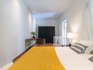 Giường trong phòng chung tại Loft frica Villas Cruz Mayor +23 ảnh