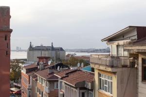 a view of a city with buildings and the water at Soft and Historic 3BR Home w Iconic Haydarpasa View in Istanbul