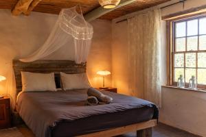 Postel nebo postele na pokoji v ubytování Watermill Farm Cottages