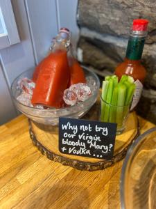 a table with two bowls of hot dogs and vegetables at Housel Bay Hotel in Lizard