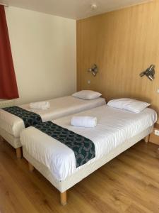 Postel nebo postele na pokoji v ubytování Fasthotel Annecy