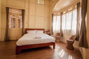 Ένα ή περισσότερα κρεβάτια σε δωμάτιο στο OOtO Homestay
