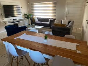 a living room with a table and chairs at 16 on Swallow in East London +11 photos